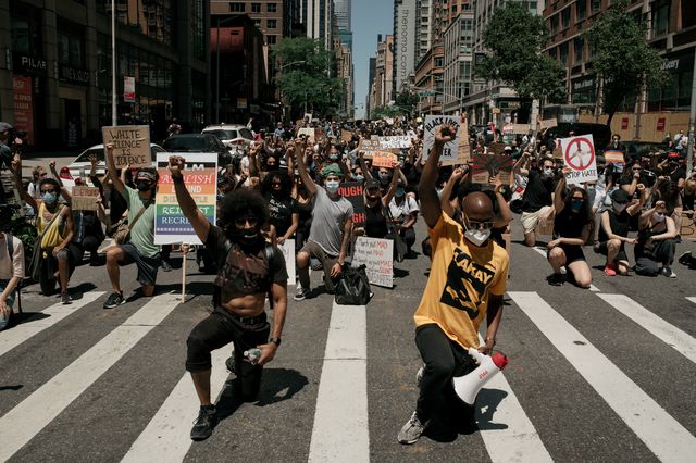 Protesters take a knee on Fifth Avenue on June 13, 2020
